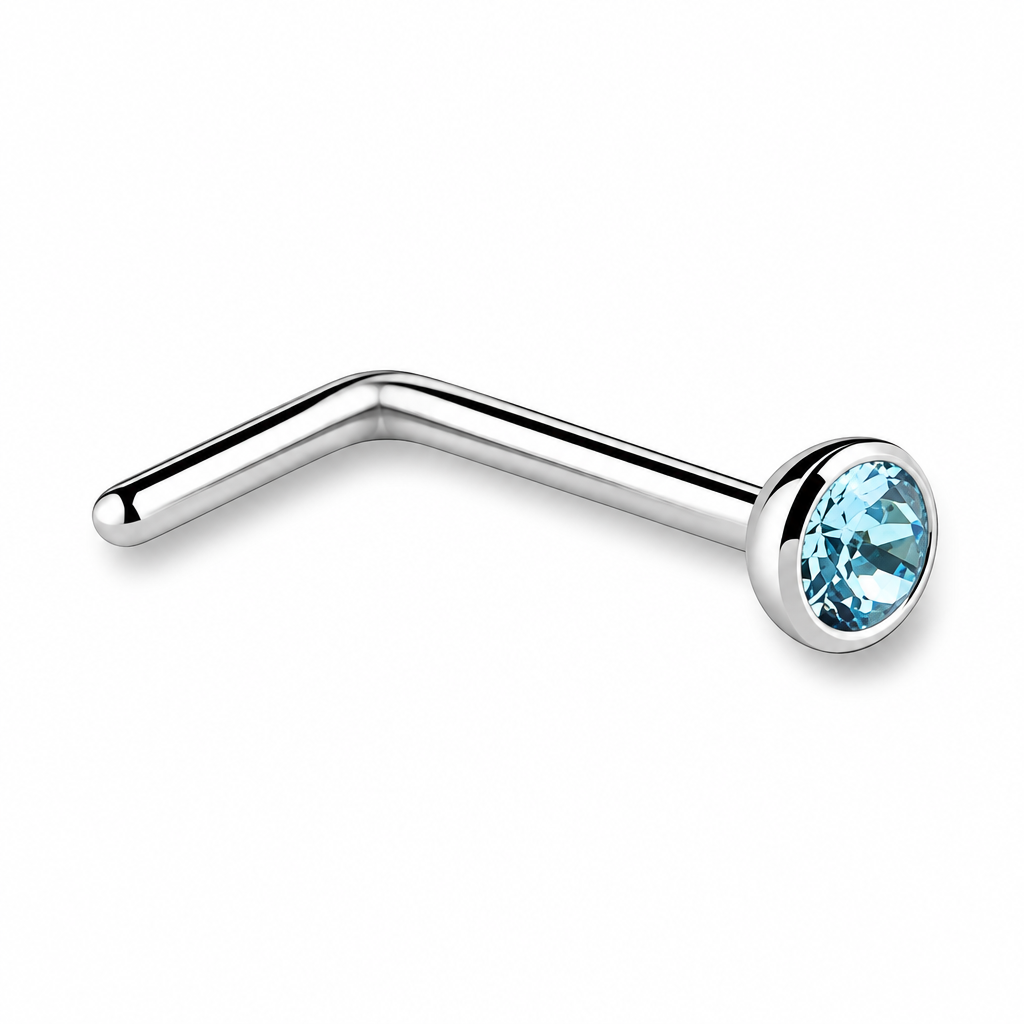 A silver-colored curved barbell nose stud with a light blue faceted gemstone in a bezel setting, shown on a plain white background.