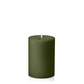 An olive green pillar candle with a single white wick, centered against a solid white background.
