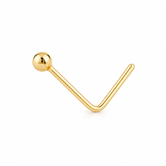 A single gold labret stud earring with a polished ball-shaped top and a straight post, shown on a plain white background.