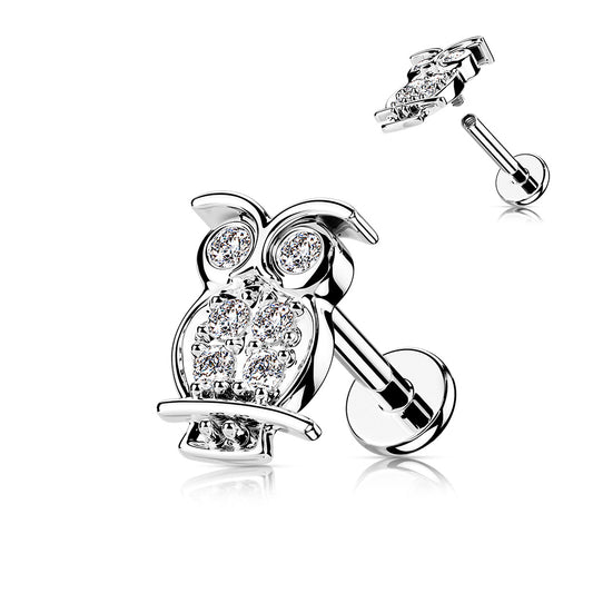 Silver labret bar with an owl design, encrusted with small crystals, on a flat back setting.