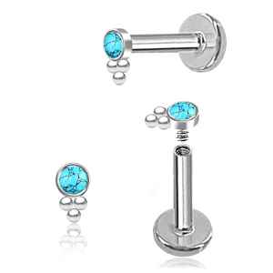 Pair of silver nose rings with turquoise gemstones on a white background