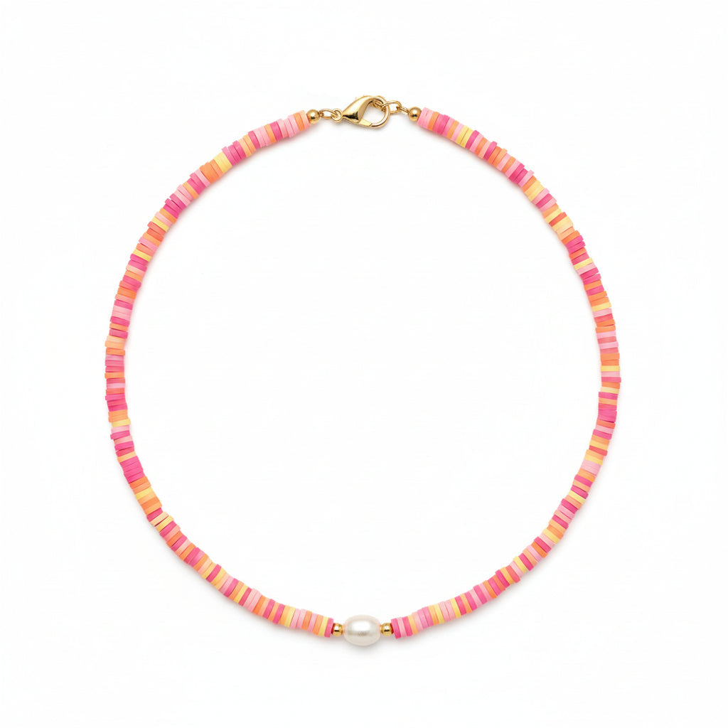 Person wearing a colorful beaded necklace on a plain background