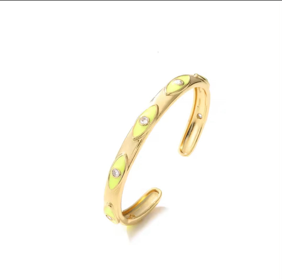 A gold-toned open cuff bracelet featuring a series of teardrop-shaped light green enamel inlays, each accented with a small clear rhinestone, shown on a plain white background.