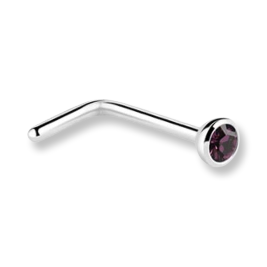 A curved silver-tone metal labret piercing stud with a faceted dark purple gemstone in a bezel setting, shown on a plain white background.