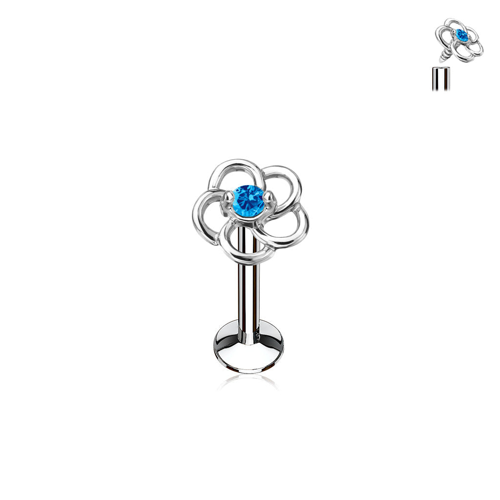 Silver barbell with floral design and blue gemstone on a white background