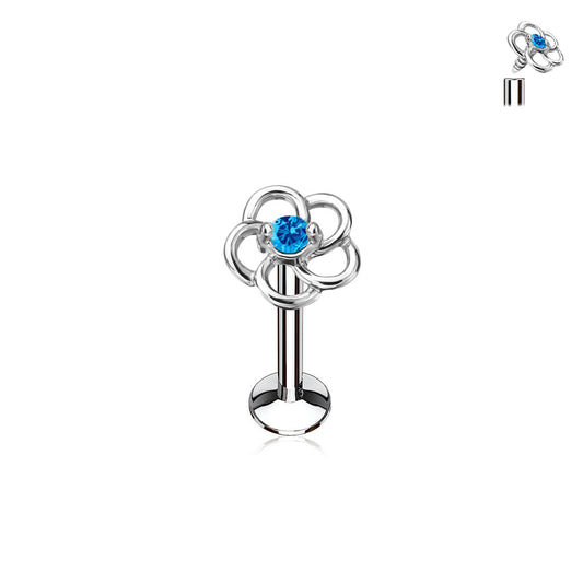 Silver barbell with floral design and blue gemstone on a white background