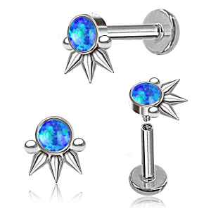 Pair of silver earrings with blue gemstones on a white background