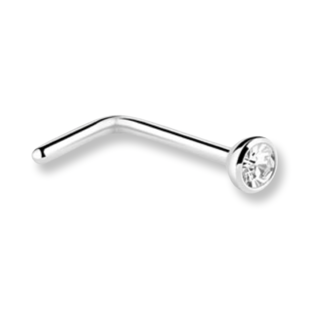 A silver-toned curved barbell stud piercing with a clear faceted gemstone in a bezel setting, shown on a plain white background.