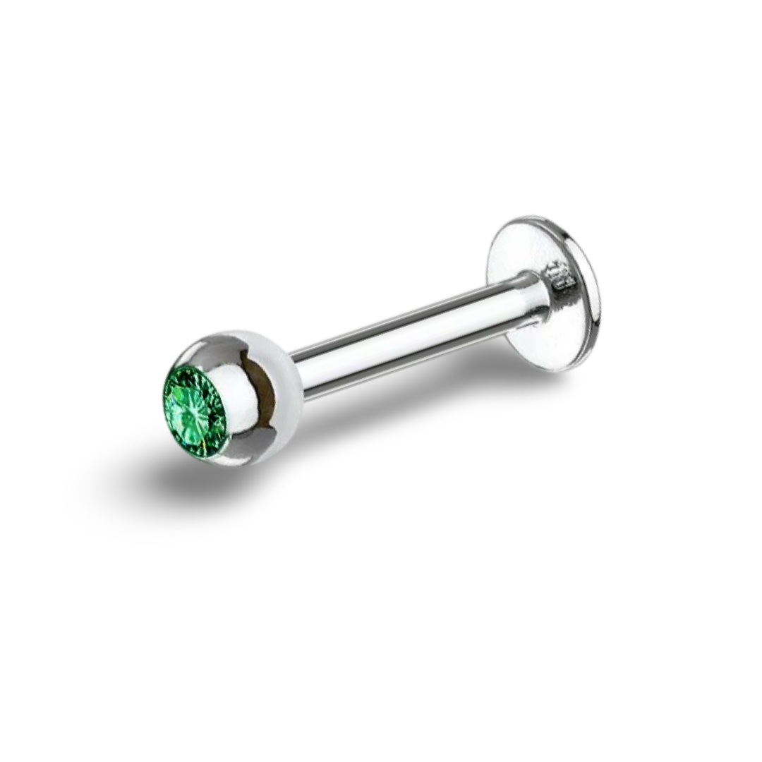 A 16 gauge surgical steel labret bar with a green gemstone at the base.