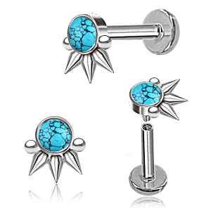 Pair of silver and turquoise spike earrings on a white background