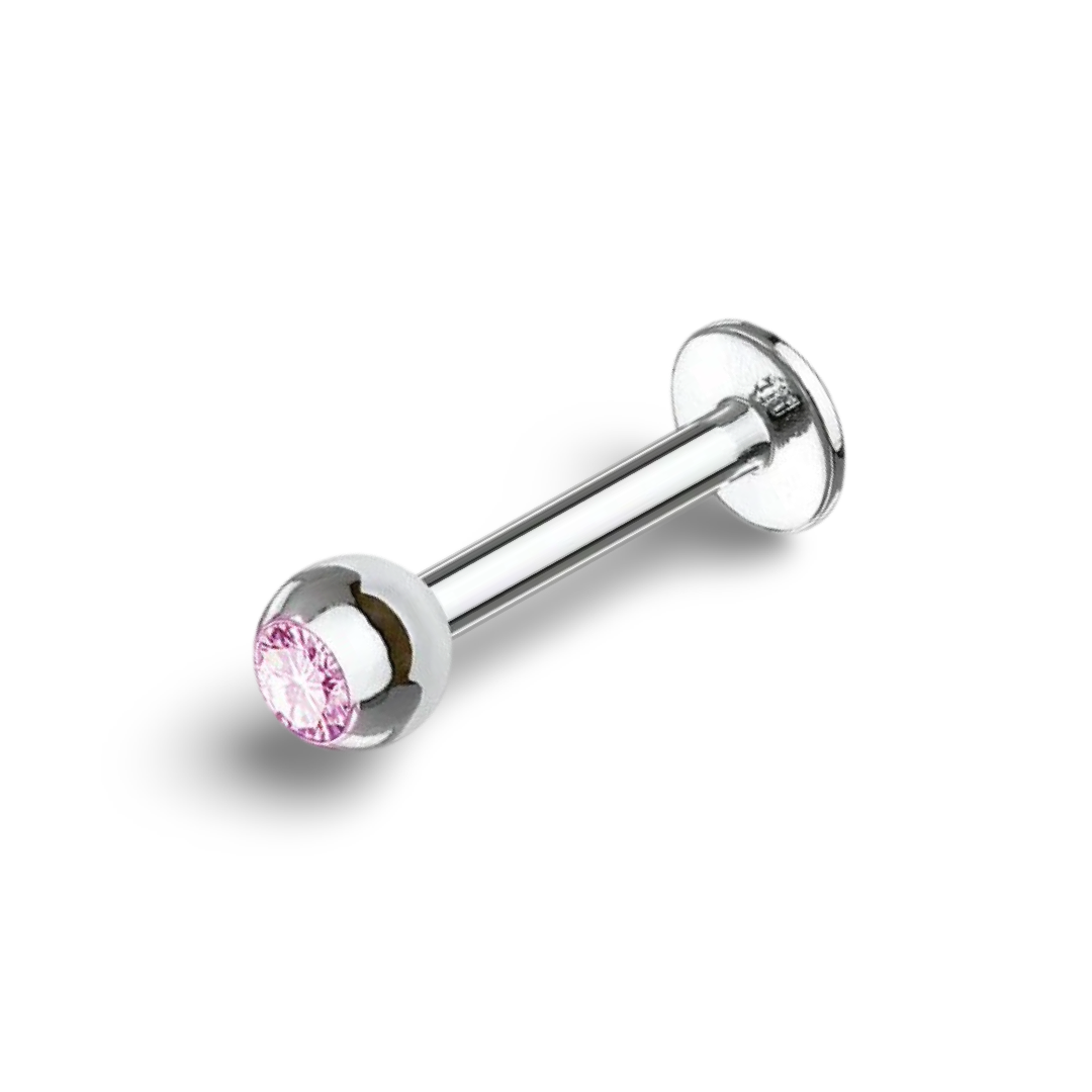 A silver-colored surgical steel labret bar with a light pink gemstone at the base.