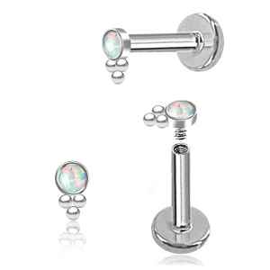Pair of silver piercings with opal gemstones on a white background