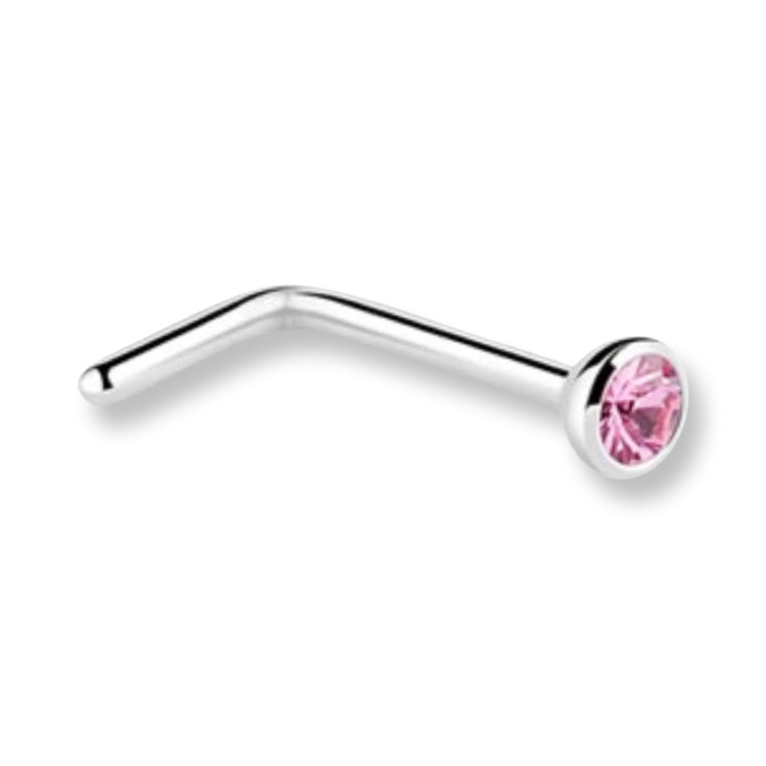 A curved silver-tone nose stud piercing with a faceted pink gemstone in a bezel setting, shown on a plain white background.