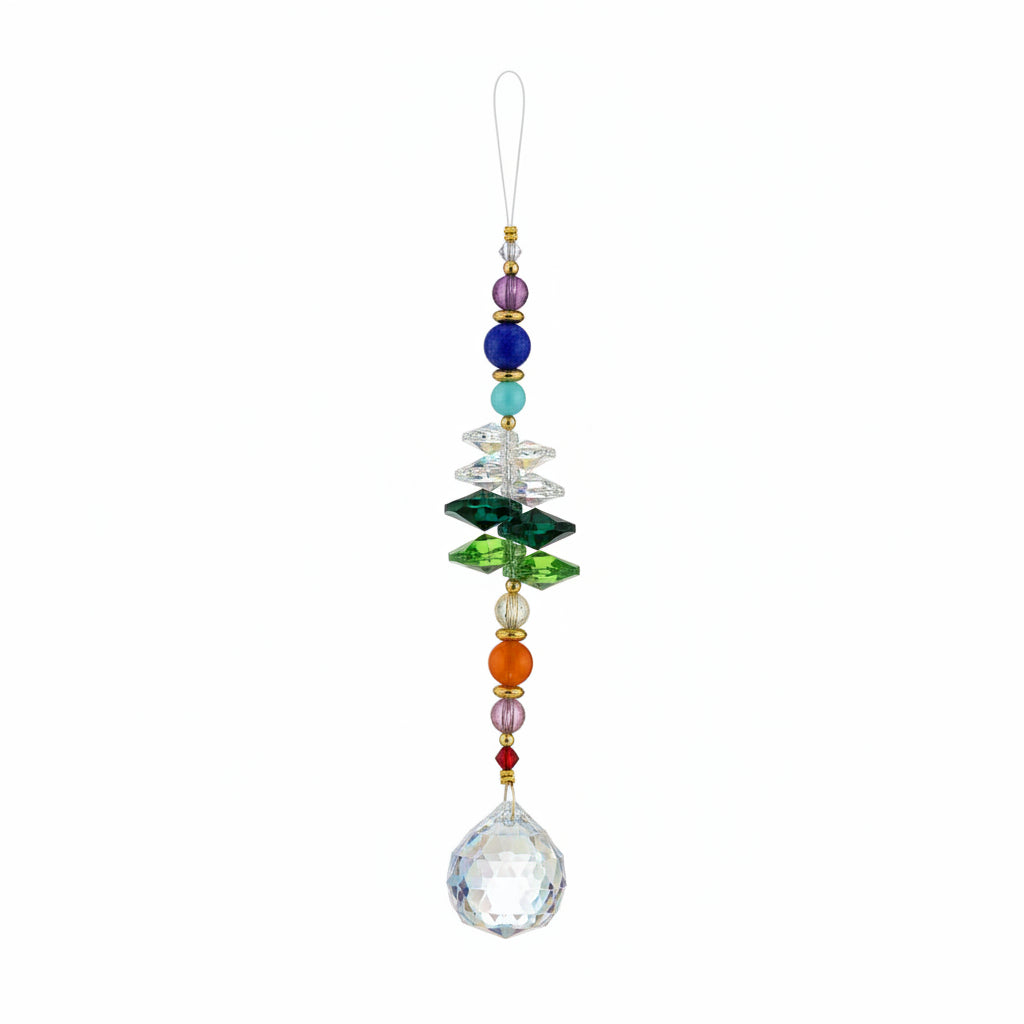A beaded glass ornament labeled '$14 Rainbow Hope' hanging from a gold string, resting on a scratched brown wooden surface. The ornament features a large iridescent teardrop bead at the bottom, surrounded by various colorful glass beads in blue, green, orange, and clear.
